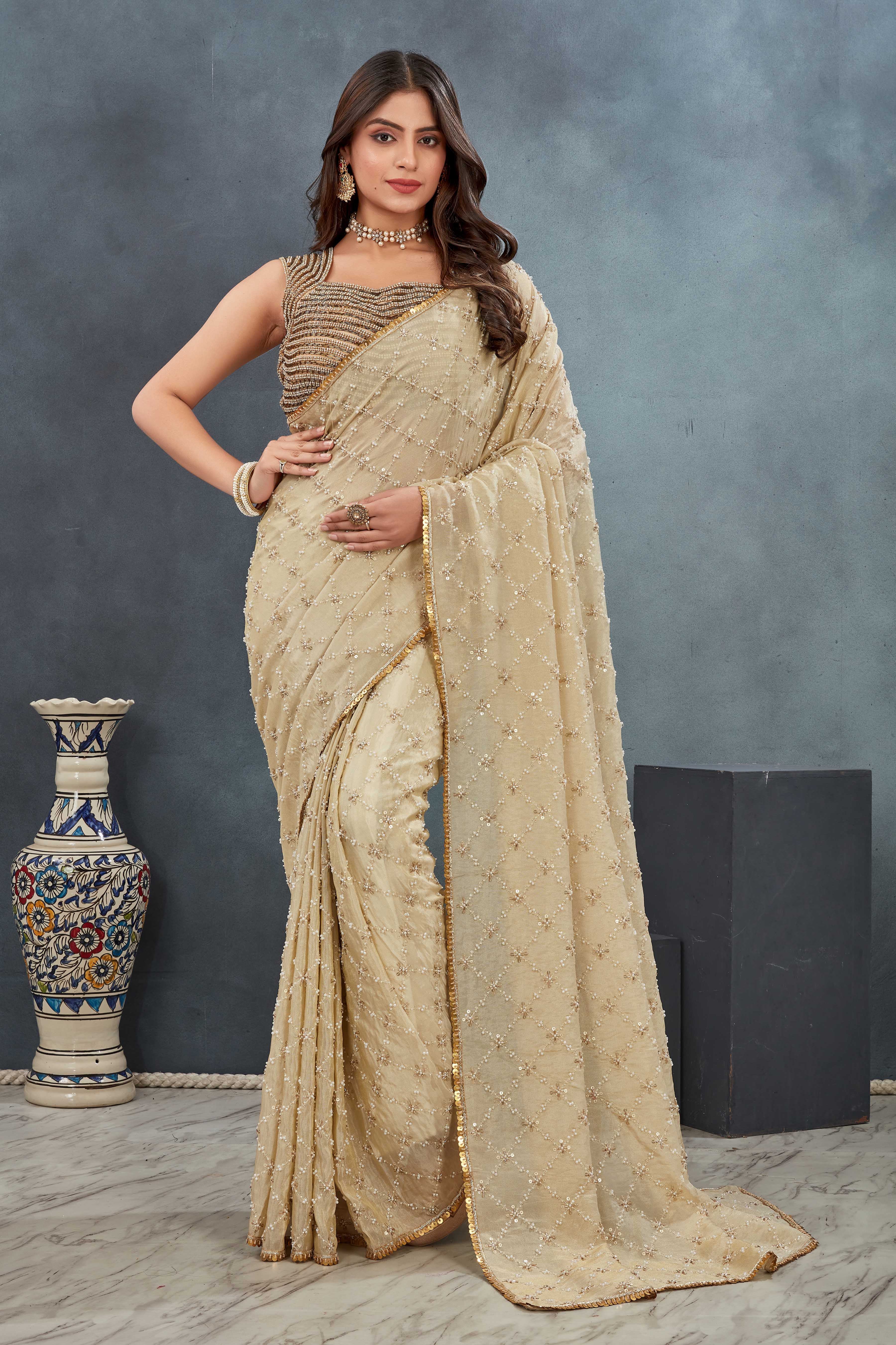 Hand Embroidered beige Saree