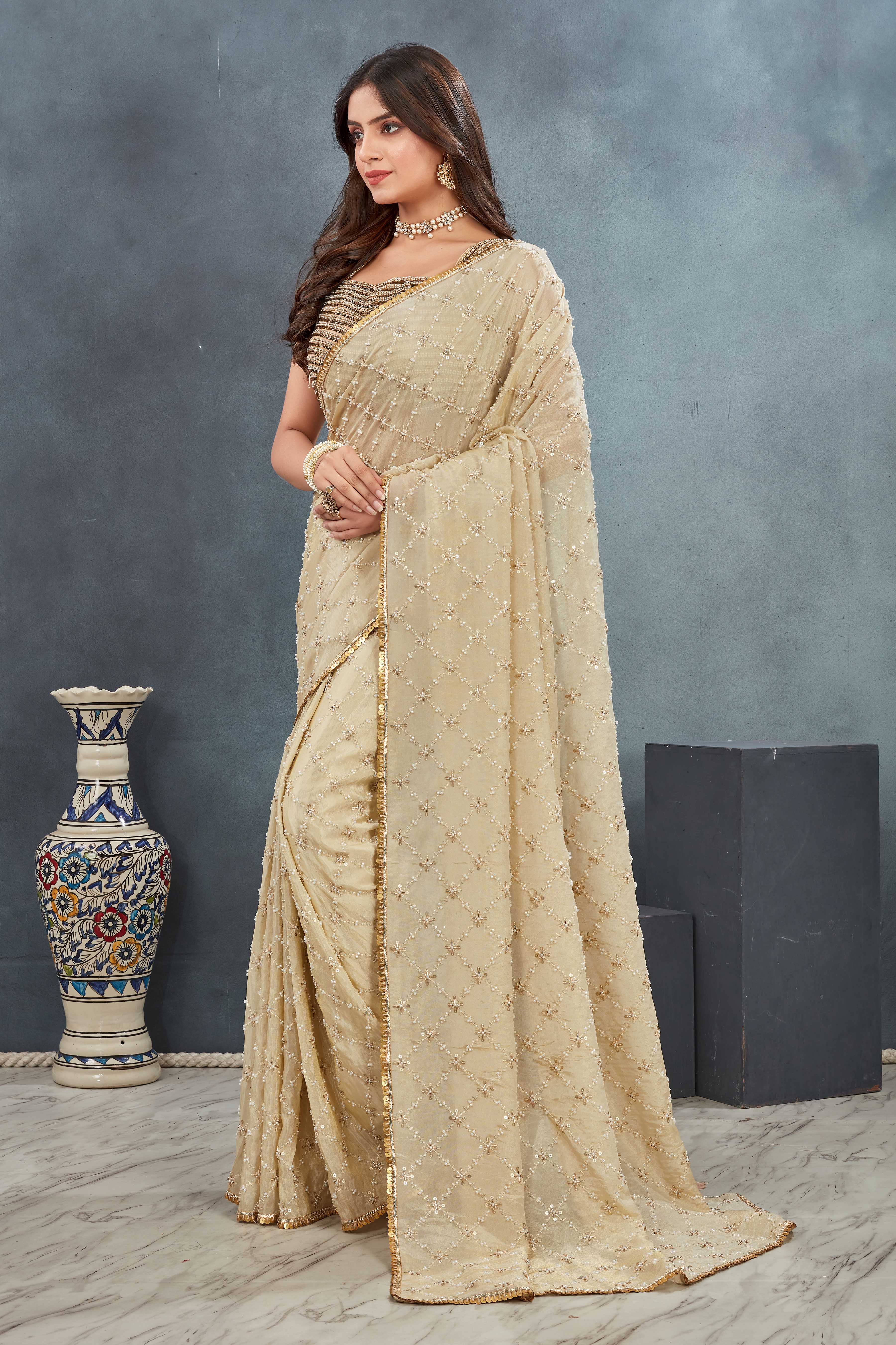 Hand Embroidered beige Saree