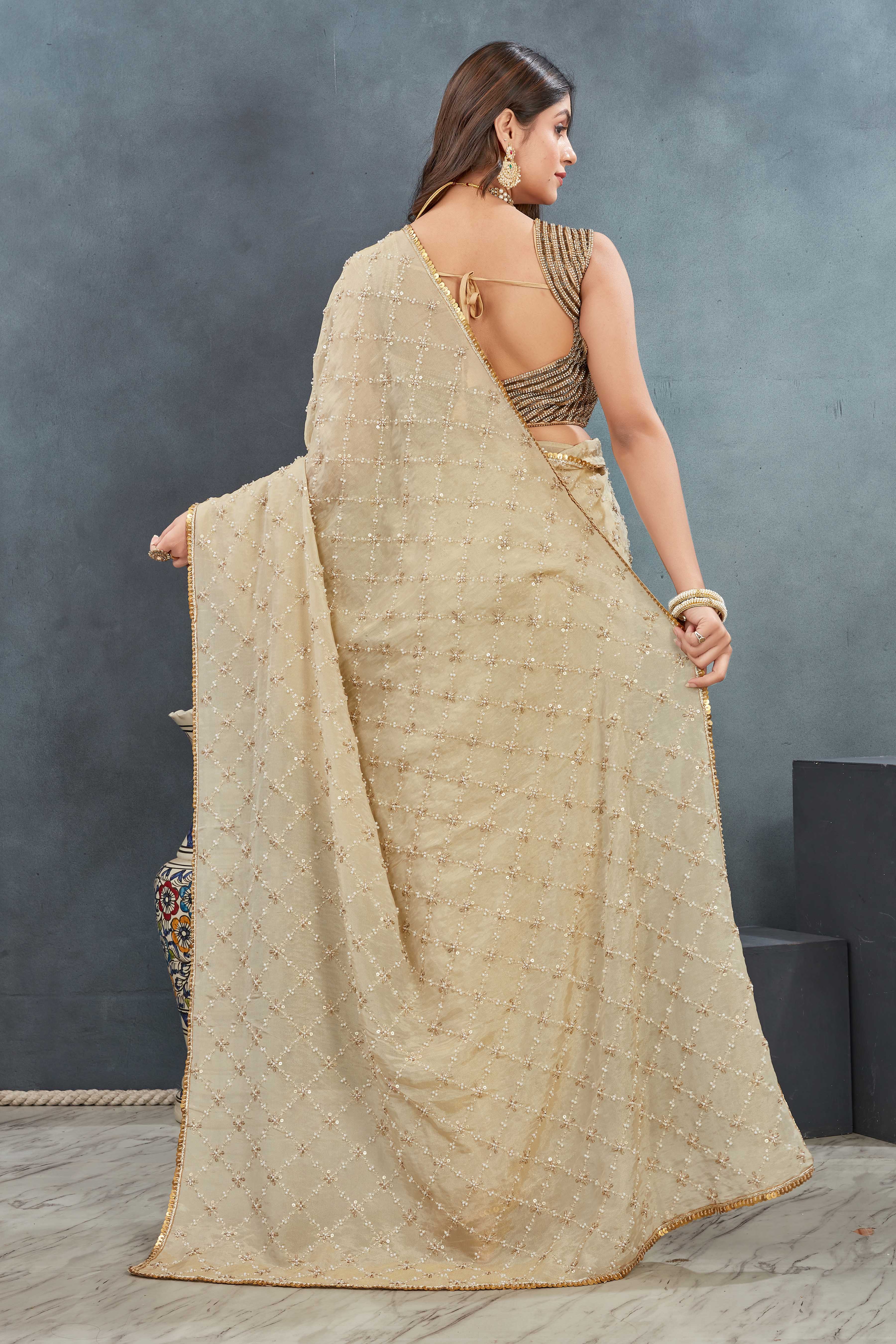 Hand Embroidered beige Saree