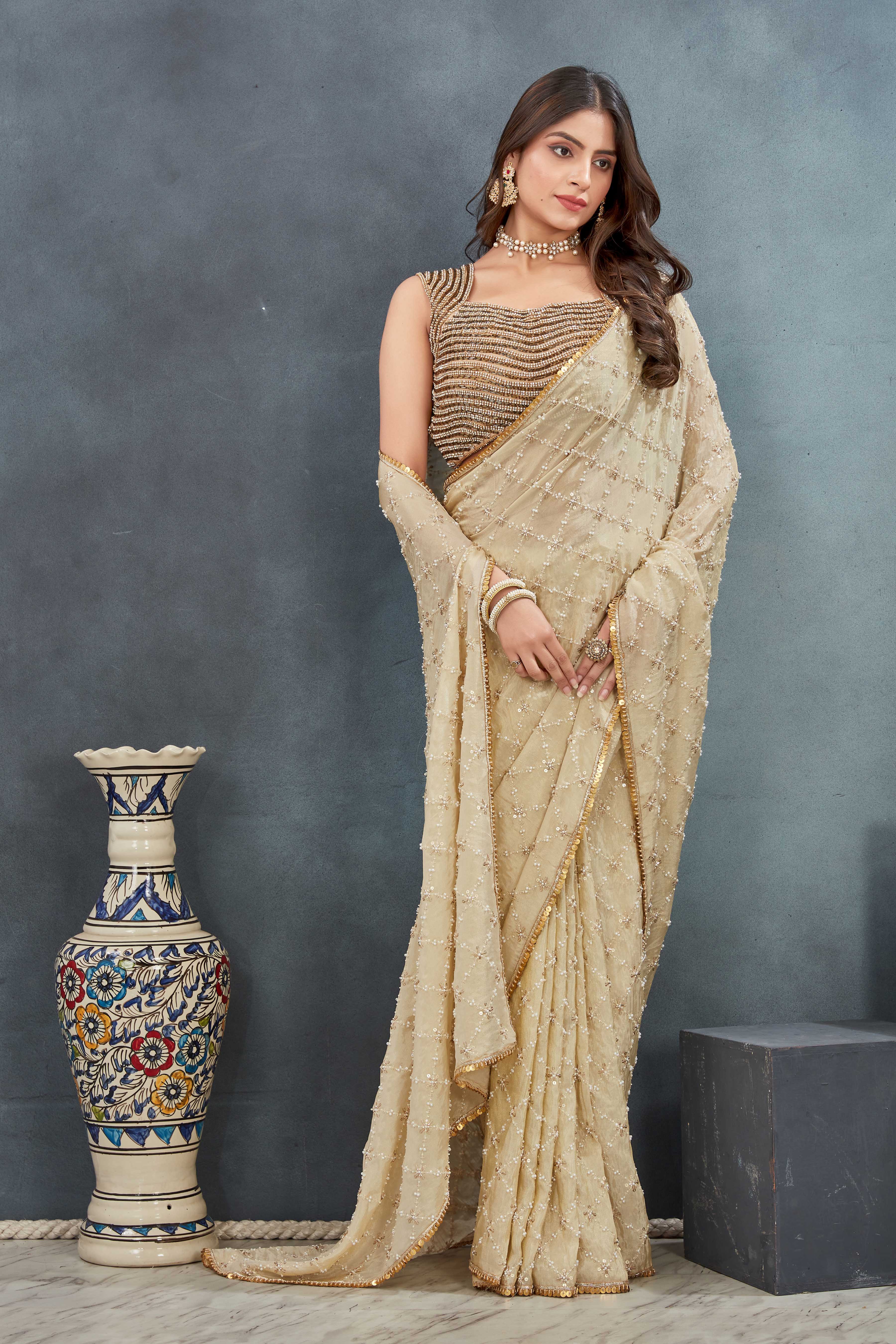 Hand Embroidered beige Saree