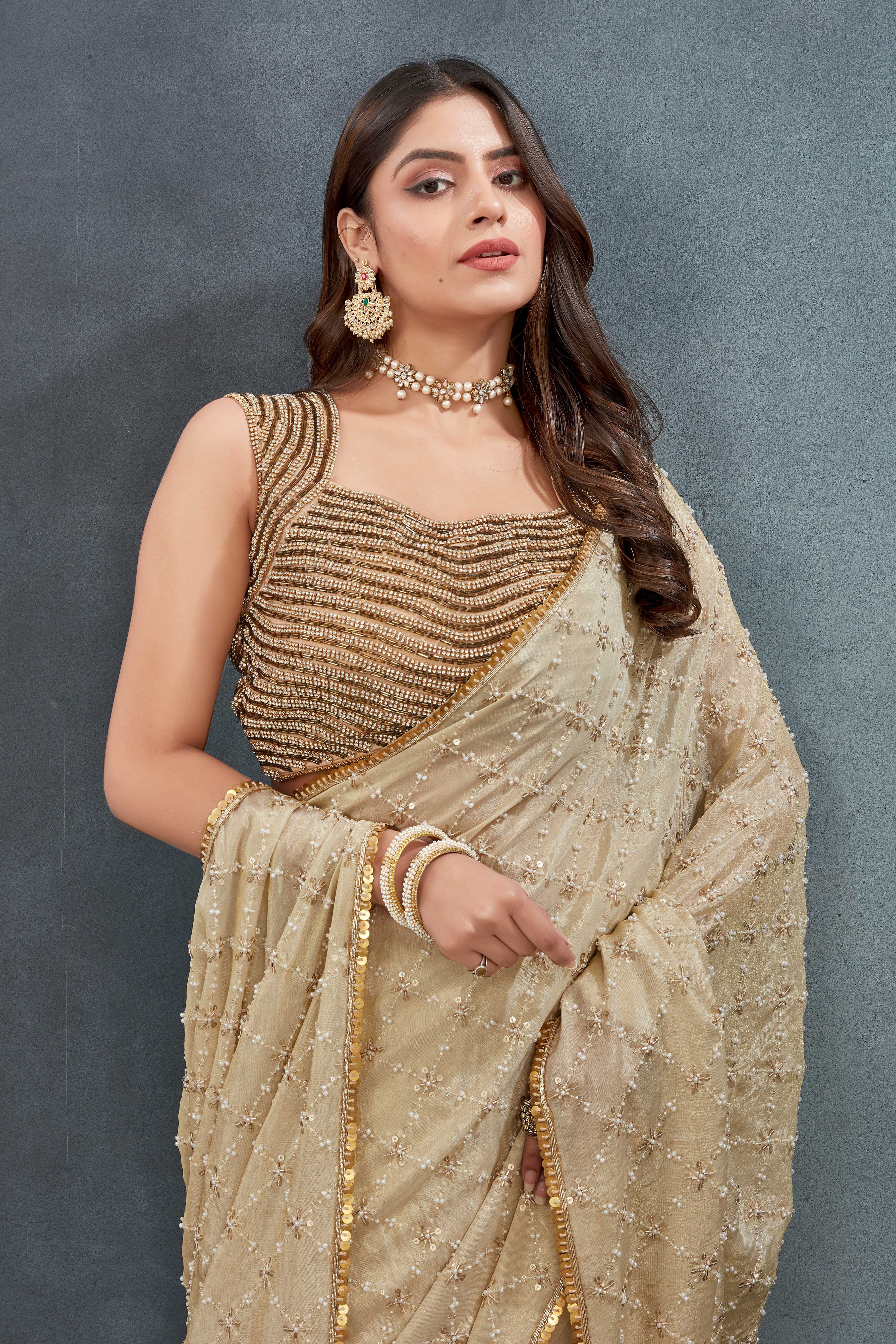 Hand Embroidered beige Saree